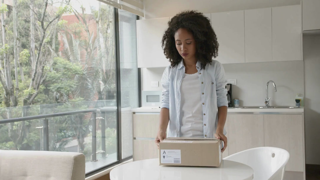woman opening a shipping package